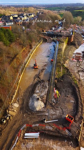 Breach repairs ongoing in the glorious mud.