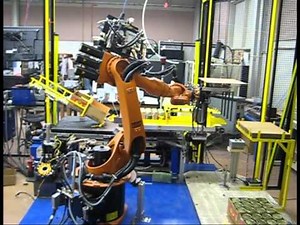 Kuka robot boxing jars and stacking boxes on pallets