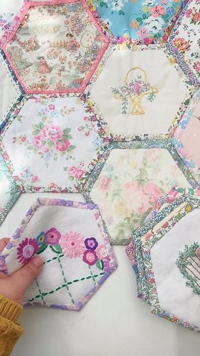Emma Jones on Instagram: "What’s your go to comfort project? Mine is this one, my happy memories quilt as you go hexagon quilt. I’m planning on adding a lot more hexagons to it this week using a mixture of new fabrics from @elmhirstfabrics and @rosegardenpatchwork and also ones I’ve repurposed from vintage linens. I’m backing each hexagon with Liberty and it creates a two in one quilt, where both the front and back is patchwork. Check out my stories today to see the back. Have a great day! #hexa