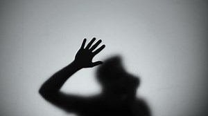 Hardly breathing silhouette trying to getting out from room, fire emergency