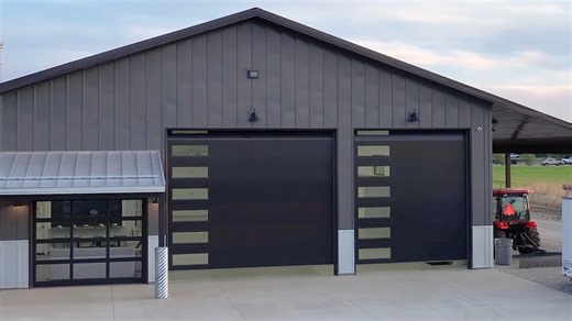 🏢 This is how it looks when your garage doors become the design statement! Here, a contemporary business barn features coordinating Hörmann models in dark bronze—proof that functional doesn't mean forgettable. 💡Energy efficiency combined with natural light and airtight performance for a modern aesthetic that commands attention. Mix and match models to customize both performance and style for your space. 👉 Ready to design? www.hormann.us #Hörmann #GarageDoors #ModernDesign #CommercialDesign #B