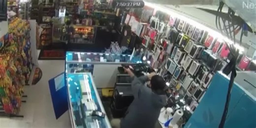 Surveillance video captures store employee shooting two armed robbery suspects
