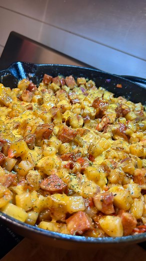 Chef Qdaddy👨🏽‍🍳🤎 on Instagram: "Breakfast made easy: a potato skillet loaded with smoky sausage + melty cheese, ready in under 30 mins ⏱️🔥 . . #cookitupqdaddy #breakfast #fyp #chef #goodeats #sausages #viral #potatoes"