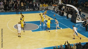 Basketball Game in a Modern Arena: White Team Attacking the Basket, Passing the Ball to a Star Player, Who Scores a Goal From Under the Basket. Sport Broadcast Television Playback
