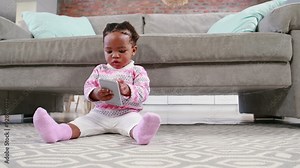 Little girl playing on the floor