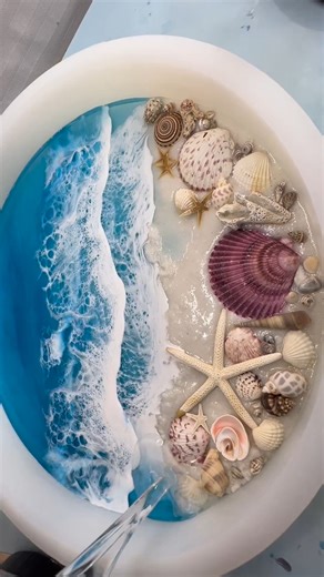 Time to finish a project! Sand, shells, water, waves,deep pour, cure, sand and top coat! Lots of steps and days in creating these one of a kind oceans. Can’t wait for the reveal Project: @tidalwaveresin @craftedelementsco @superclearepoxy #coastaldecor #oceanart #resinart #oceanlover #reels #reelsinstagram #coastalart #beachy #tropical #coastal #homedecor #design #etsyfinds #explorepage #resinart_daily | Crafted Elements