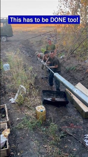 Russian Tank Crew Cleaning the T-72B3M Main Gun in the Field