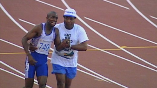 Derek's Father Helps Him Across The Finishing Line