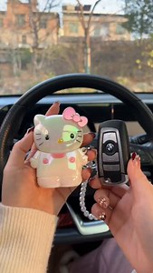This Hello Kitty key cover is so cute! Made of soft, adorable silicone, it's comfortable to hold and protects your keys while being incredibly distinctive, adding a touch of style to your keychain. #CarGadgets #SoCute #CarKeyCover #CartoonKeyCover | Automotive Supplies Mall