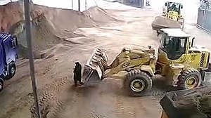 Moment bulldozer accidentally scoops up women and buries her