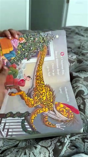 Little toddler impressively reads every word aloud from book