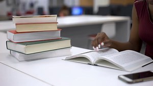 Girl Studying In Books At Library Table 4k Stock Footage SBV-337702127 - Storyblocks