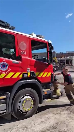 Firefirghtes push failed fire truck from blaze