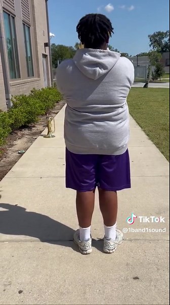 Sousaphone Girl Shines in Marching Band Performance