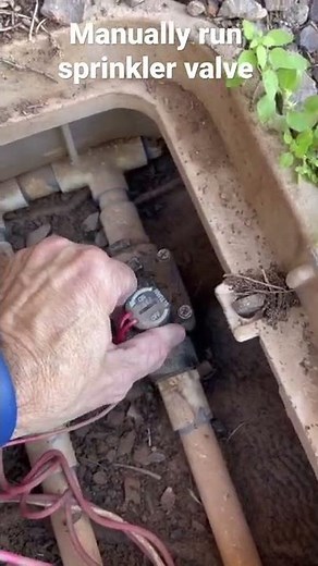 Manually run a sprinkler valve without the timer.