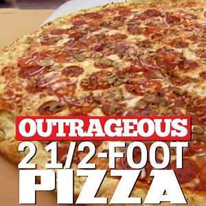 As seen on Outrageous Foods... a 2 1/2-foot pizza! | Food Network