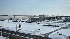 Timelapse of shopping mall construction process from winter till summer. Industrial works upon large building assembling. Long term cycle of construction