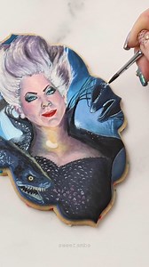 🧜‍♀️ I painted this cookie portrait of @melissamccarthy as Ursula with @sweetsticksau edible cake paint. It's one of my favorite cookies I've done and I couldn't bring myself to let anyone eat it 😅 #thelittlemermaid #decoratedcookies #sweetambscookies #sweetsticks | SweetAmbs