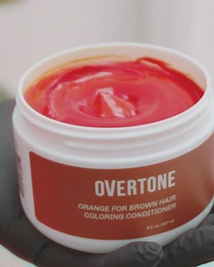 79K views · 98 reactions | Apply Orange for Brown Hair on dark brown starting shade for a subtle pop of color 李 Works on all hair types, including coils. • Video Description: person applying Orange for Brown Hair Coloring Conditioner to coily dark brown hair and revealing end results | oVertone | Facebook