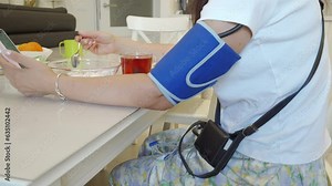 Holter monitor device and daily blood pressure recorder on human female body. Daily cardiogram monitoring. Health care and disease prevention