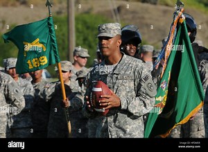 Joint Task Force Guantanamo Joint Detention Group Commander, Col. Donnie Thomas stands by to participate in an “Army Navy Spirit” video recording on Cooper Field, Nov. 16. Soldiers from Joint Task Force Guantanamo and sailors from Naval Station Guantanamo participated in the video spot, which will be sent to CBS Sports to show esprit de corps for the Army Navy football game, which will be aired on their network, Dec. 11. Army-Navy Spirit Spot 344982 Stock Photo - Alamy