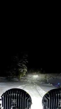 nighttime snow running in the jeep