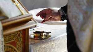 The priest performs traditional rituals at the wedding. The sacrament of marriage in Christianity. without a face.