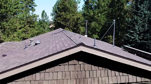 IKO #Cambridge Weatherwood is often chosen where people want to add a sense of coziness to the exterior of their #home. This rustic, informal, and laid-back shade feels right at home next to natural #materials. 😍 Its soft tones pairs great with wood panels, red brick, or warm beige stone. 🏠✨ #CurbAppeal Tip: Go with a brown trim to pull the look together. 😉 | IKO Roofing