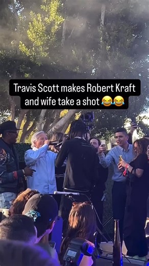 Boston Culture on Instagram: "Travis Scott handed New England Patriots owner Robert Kraft and his wife a tequila bottle, before he continued performing."