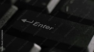 Finger continuously typing enter key close up loop footage. Hands pressed black laptop pc keyboard. Purchase, bid, exchange, tender, consent, confirmation or internet shopping concept