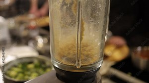 blending process, container process, motion process. Blending process highlighted in close-up dry ingredients being mixed inside blender container, showing motion in detail.