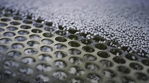 Extruder machine makes plastic granules, recycling polypropylene. Gray plastic pellets. Raw material for plastic or Polyethylene products. Garbage factory or waste plant. Recycling of plastic items