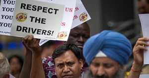 Moneywatch: Ghosn bail, Uber drivers, Tesla loss