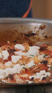 Garides saganaki is a classic Greek dish of shrimp, tomatoes, onion and feta. Cooked under the broiler, this bubbling one-pot dish is easy and so satisfying. It's the perfect way to utilize August tomatoes in your garden or from the farmers market! Be sure to serve with plenty of crusty bread to sop up the sauce. Full recipe is available here https://andrewzimmern.com/recipes/andrew-zimmern-cooks-garides-saganaki-shrimp-tomatoes-feta/ | Andrew Zimmern