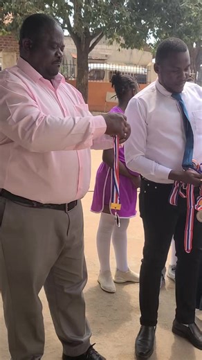 Our players receiving medals from our Director