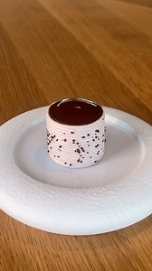 Get the Recipe on @gronda Find the link in the bio. Chef @aurelienbodennec creates elegant chocolate meringue cylinders through precise temperature control and careful piping technique. These delicate structures achieve the perfect balance of crisp exterior and light interior through slow, gentle drying. The cylindrical form adds architectural interest to plating, offering a sophisticated textural element that brings both visual drama and cocoa richness to dessert compositions. | Gronda