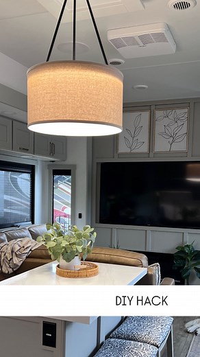 ✨ Easy DIY hack, BIG glow-up. ✨ Instead of ripping out my ‘already stable’ and gorgeous modern chandelier, I added a 20x20x11 drum shade, did a little DIY magic (pliers were involved 😂), and turned it into a timeless statement piece. I love how @brinkley_rv designs their rigs. The inside is done so tastefully, well curated and an excellent canvas with high-end quality finishes! But, I wanted something a little more ‘cozy’ over our island. And here we go! Stable, stylish, and simple — that’s my