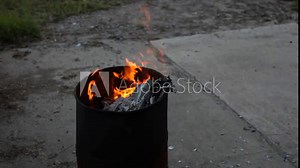 Dumpster Fire Large Orange Flames Lick Out of Trashcan Fire