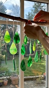 DIY Green Crayon Raindrop Suncatchers Ingredients Green crayons (mix light green, emerald, forest green, lime, teal-green for depth) Parchment paper or wax paper (2 sheets) Pencil sharpener or knife (adult use) Aluminum foil or baking sheet Raindrop-shaped cookie cutter (or draw raindrops by hand) Oven or hair dryer Scissors Hole punch or skewer String, twine, or fishing line Suction hooks (optional) Instructions 1. Shave the Crayons Peel the wrappers off the green crayons. Use a sharpener or kn