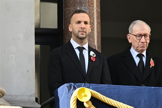Zack Polanski wears a white poppy as he overlooks Remembrance Sunday ceremony at the Cenotaph