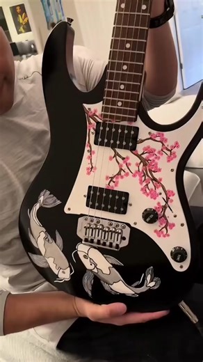 We hand-paint guitars, customized to your desired design! Check out our latest project and all the work that goes into perfecting your guitar - from dismantelling to painting to sanding to waxing. Get yours on Etsy with Guitar Art By Josh! 🌸 #guitarart #guitarartist #guitar #guitartok #guitarist #art #artist #painting #paint #cherryblossom #koifish #johnmayer #life