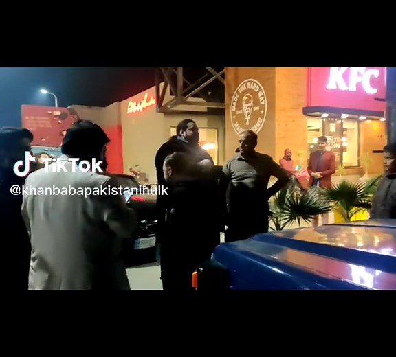 Late Night Conversations Outside KFC in Mardan