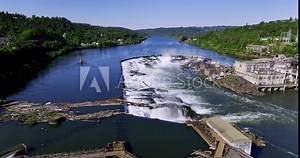 The Willamette Falls is a horseshoe-shaped block waterfall caused by a basalt shelf in the river bottom. The 42-foot-high and 1,500-foot-wide falls is located in Oregon City Oregon