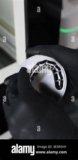 Dentist hands in black gloves clean titan disk with impression tray of advanced dental digital system closeup. Computer aided design lathe machine in medical laboratory vertical video Stock Video Footage - Alamy
