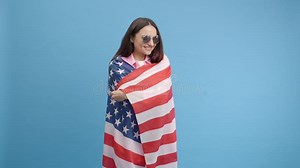 Happy Smilling Girl in American Glasses Waving and Wrapping in American USA Flag, Celebrating Stock Video - Video of human, indoors: 277745151