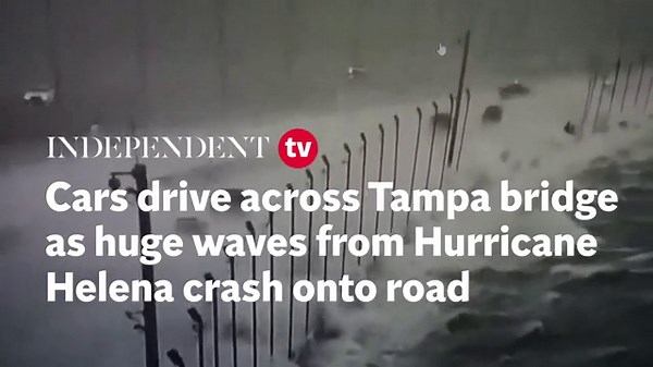 CCTV shows cars driving across Tampa bridge as 130mph winds and dangerous waves from ‘unsurvivable’ Hurricane Helena crash onto road