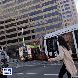 Shocked commuters have captured the moment a fire truck collides with a tram outside of Sydney’s Central Station this morning. Three people sustained minor injuries when the service was knocked off its tracks. The incident is expected to take six hours to clear, with services between Central and Circular Quay impacted. MORE: http://9Soci.al/TG0w50KzW1Q #9News | WATCH LIVE 6pm | 9 News