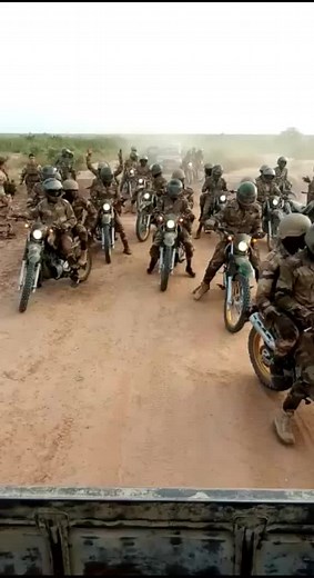 Military Motorcycle Convoy in Scenic Landscape