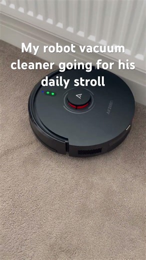 My robot vacuum cleaner going for its daily stroll