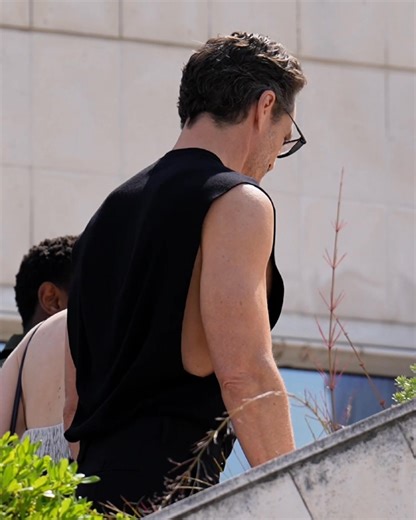 Pedro Pascal wore Calvin Klein Collection Fall 2025 to the "Eddington" photocall at the 78th Cannes Film Festival. Seen in a black sleeveless merino wool tunic and wide-leg wool trousers. | Calvin Klein